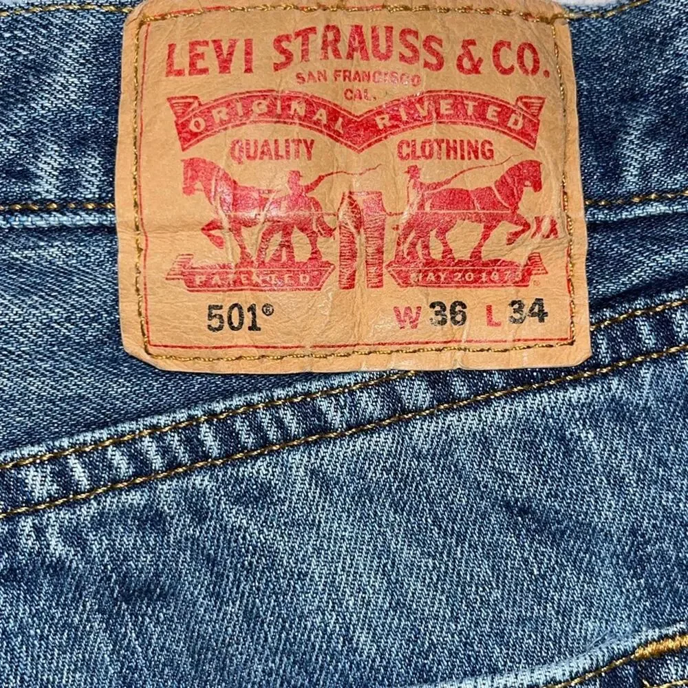 Vintage Levi's 501 cut-off denim shorts with a button fly and frayed hem